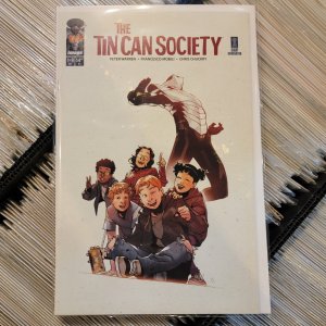 The Tin Can Society #1 Error Recalled Cover Comic Book 2024 - Image