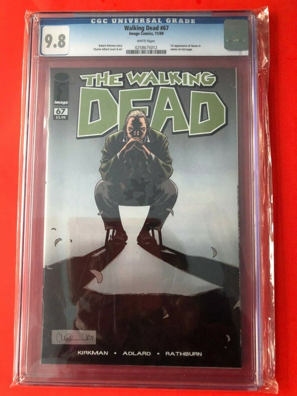 THE WALKING DEAD #67 CGC 9.8 WHITE 1'ST AARON