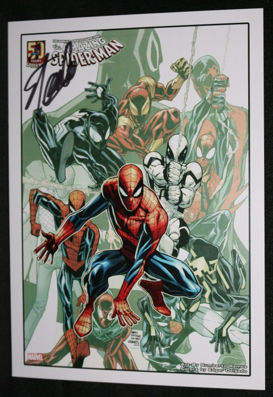 Lot - A Spider-Man 2 poster book signed by Stan Lee