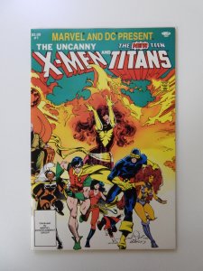 Marvel and DC Present featuring The Uncanny X-Men and The New Teen Titans NM-