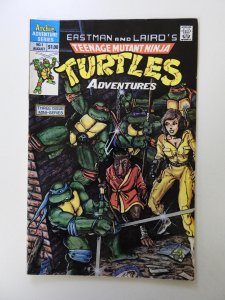 Teenage Mutant Ninja Turtles Adventures #1 (1988) VG moisture damage