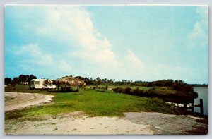 Ft Myers Florida~Camper~Straw Roof Gazebo~Wheelchair~Jetty~Vintage Postcard