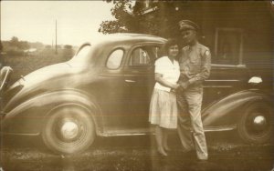 US Serviceman & Wife Pose w/ Old Car Buick? c1940 Real Photo Postcard