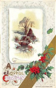 A JOYFUL CHRISTMAS Holly Berries Leaves Cabin In Snow John Winsch Postcard 1913