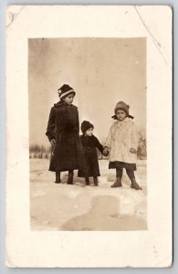 RPPC Children in Snow Coats and Hats c1910 Real Photo Postcard J23