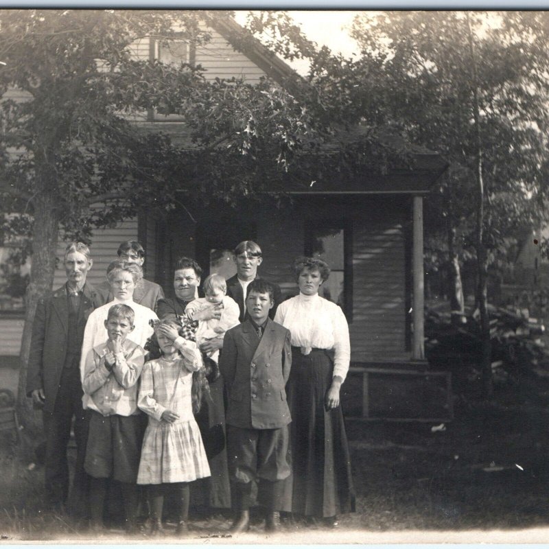 c1910s Sun-Squinting Family by House RPPC Outdoor Men Women Cute Real Photo A142