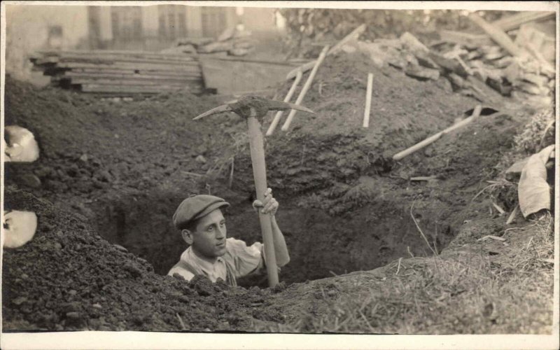 From a Utica NY Group Man Digs Hole Pick Axe Tool CRISP Real Photo Postcard