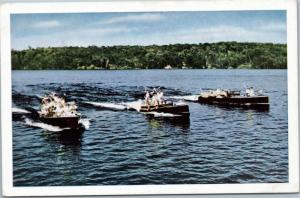 People motor boating on Ontario inland lakes