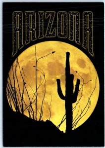 Postcard - A solitary cactus silhouetted by the full moon on a low ridge - AZ