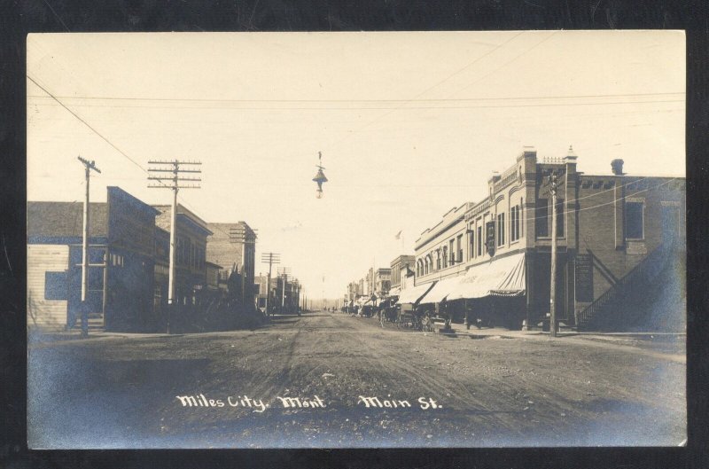 RPPC MILES CITY MONTANA DOWNTOWN STREET SCENE STORES REAL PHOTO POSTCARD