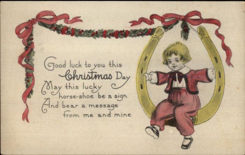 Christmas - Little Boy Sitting in Horseshoe Hand Colored c1910 Postcard rpx