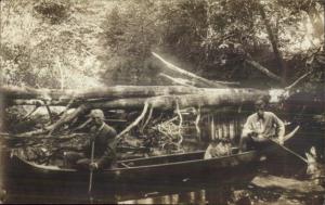 Men in Canoe Downed Tree CRISP IMAGE Amateur c1910 Real Photo Postcard