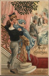 Christmas Boy and Girl Kissing Under Mistletoe Staircase c1910 Postcard