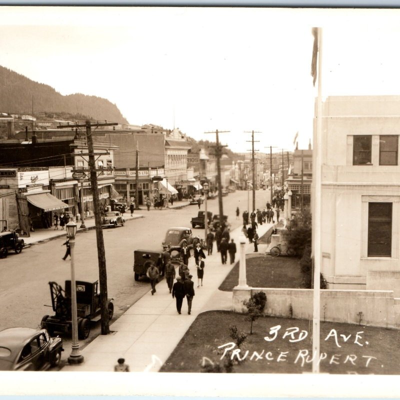 c1930s Prince Rupert, British Columbia RPPC 3rd Ave Downtown Shop Sign Cars A326