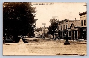 J90/ Juneau Wisconsin RPPC Postcard c1910 Oak Street Stores Fountain 309