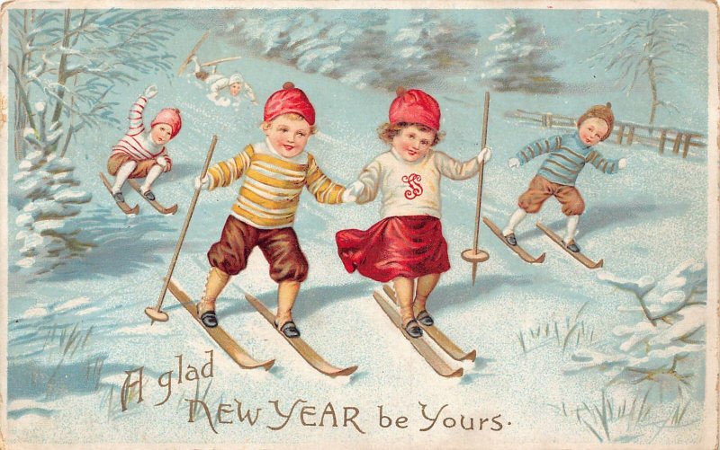 B452 New Year Greetings Children Skiing Winter Sport Snow vintage postcard