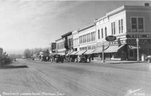 H41/ Montrose Colorado RPPC Postcard 1949 Main Street Stores Autos Truck