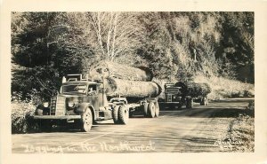 Postcard RPPC 1930s Logging trucks Lumber Pacific Northwest Christian 23-1338