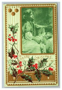 Vintage 1910's Christmas Postcard - Cute Girl with Baby in Bed Mistletoe Gold