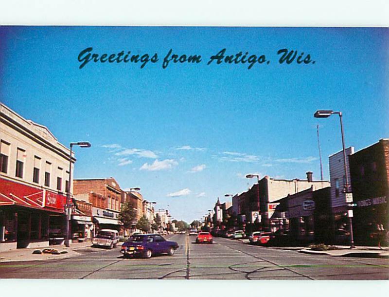 Antigo Wis Street Scene Business Dist Dougs Music Store  Postcard # 8039