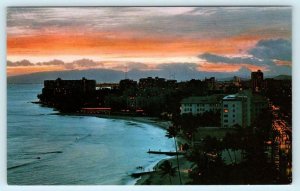 WAIKIKI BEACH, Hawaii HI ~ Birdseye at TWILIGHT TIME ca 1950s-60s  Postcard