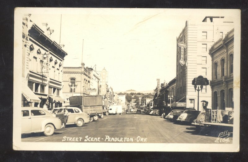 RPPC PENDLETON OREGON DOWNTOWN STREET SCENE 1940's CARS REAL PHOTO POSTCARD