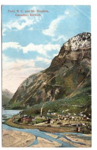 Village, Train Tracks with Train, Field and Mt Stephen, British Columbia