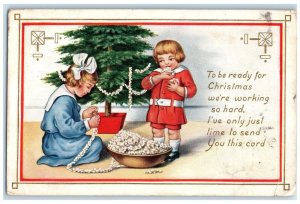 c1910s Christmas Tree Children Decorating Brooklyn New York NY Embossed Postcard
