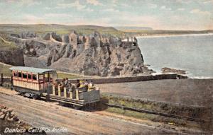 DUNLUCE CASTLE COUNTY ANTRIM IRELAND-SIGHT SEEING TRAM POSTCARD