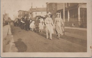 RPPC Postcard Parade People in Costume Walking Down Street C. 1900s