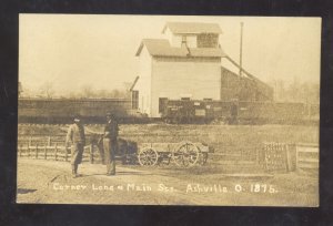 RPPC ASHVILLE OHIO MAIN STREET SCENE RAILROAD TRAIN AZO REAL PHOTO POSTCARD