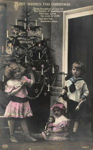 Best Wishes For Christmas Children Trimming The Tree Doll Toys RPPC