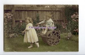 ch0286 - Children play on the Lawn with the Gardeners heavy Roller - postcard