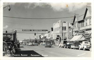 RPPC 2193 Anchorage AK Busy Fourth Ave. Street Scene, Fur Rendezvous Banner