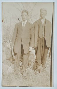 RPPC Attractive Men Father Son in Tall Grasses Rocks Postcard U14