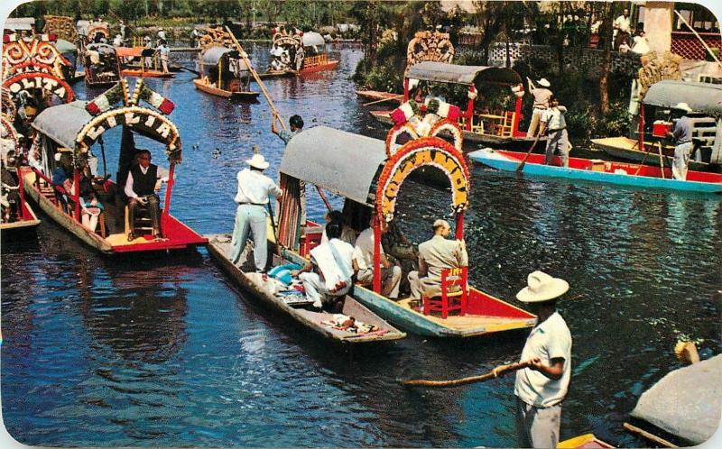 Mexico Xochimilco typical flower-decked boats carry excursionists