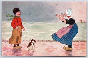 Mother And Daughter Playing At The Seashore With The Cute Dog Postcard