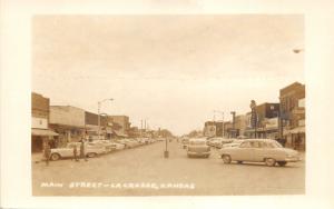 La Crosse Kansas~Main Street~Rexall Drugs~Classic Cars~1950s RPPC Postcard