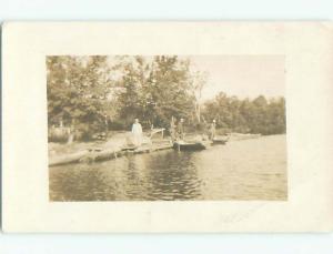 Pre-1918 rppc PEOPLE BY ROW BOATS AT DOCKS o1791