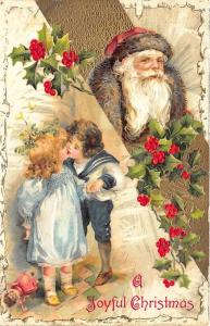 Santa Claus A Joyful Christmas Boy Girl Kissing Postcard
