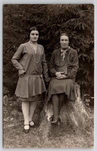 RPPC Two Women Dresses In Forest On Large Tree Stump Real Photo Postcard Q22