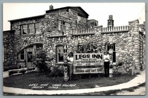 Postcard RPPC c1950s Cross Village MI Legs Inn View Of Exterior Carvings Signage