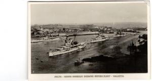 Old Real Photo Postcard of Malta Harbour showing British Fleet Valletta