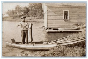 1907 Fisherman 36 Pound Muskey Fish Fishing Boathouse RPPC Photo Postcard