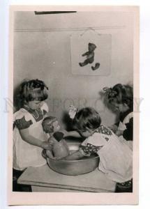 237066 RUSSIA CHILDREN wash doll TEDDY BEAR on wall photo by Trachtenberg