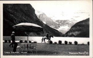 Lake Louise Alberta AB Men Horseback Riding Real Photo Vintage Postcard