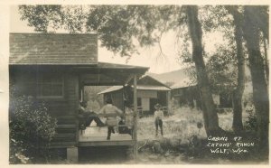 Postcard RPPC -C910 Wyoming Wolf Cabins Eaton Ranch occupation roadside 23-12334