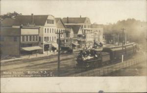 Butler NJ Main Street RR Train & Bldgs c1910 Real Photo Postcard spg