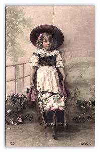 Postcard Young Girl Wheelbarrow Flowers Easter Eggs Hand Colored RPPC B.N.K. #3