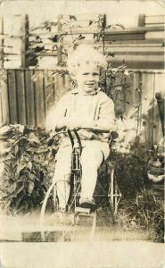 Cute Child Tricycle in yard C-1910 RPPC Photo Postcard 2712